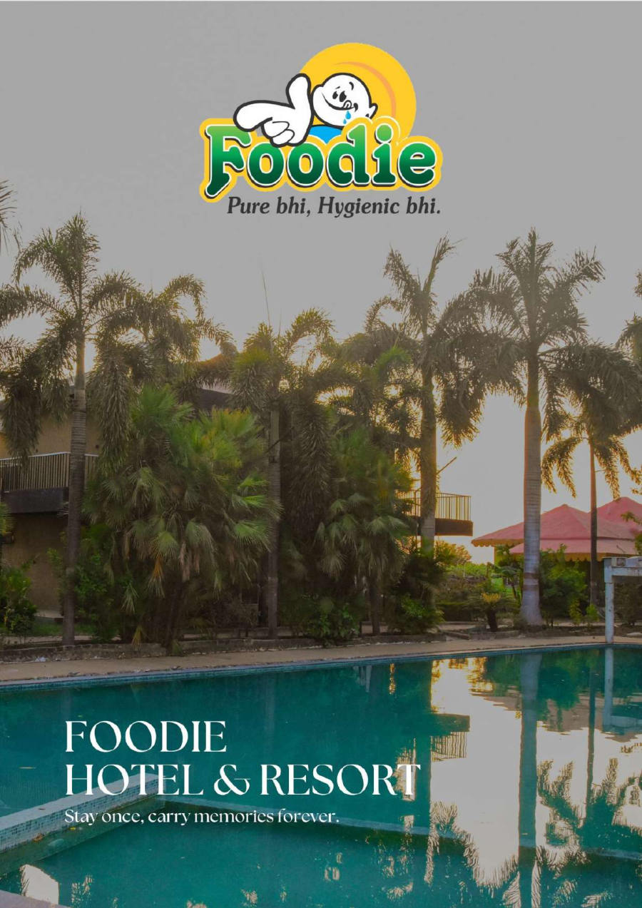 Foodie Hotel & Resort pool at dusk